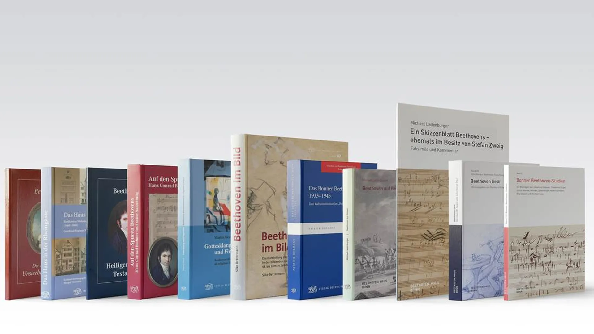 Elf verschiedene, in einer Reihe aufgestellte Bücher aus dem Verlag Beethoven-Haus repräsentieren das vielseitige Verlagsprogramm.